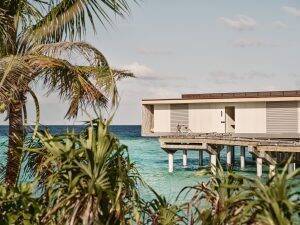 External view of the Patina Maldives Sunset Water Villa