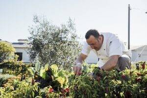Massimo Falsini working in his garden at Rosewood Miramar Beach