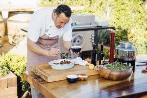 Massimo Falsini cooking an octopus at Rosewood Miramar Beach